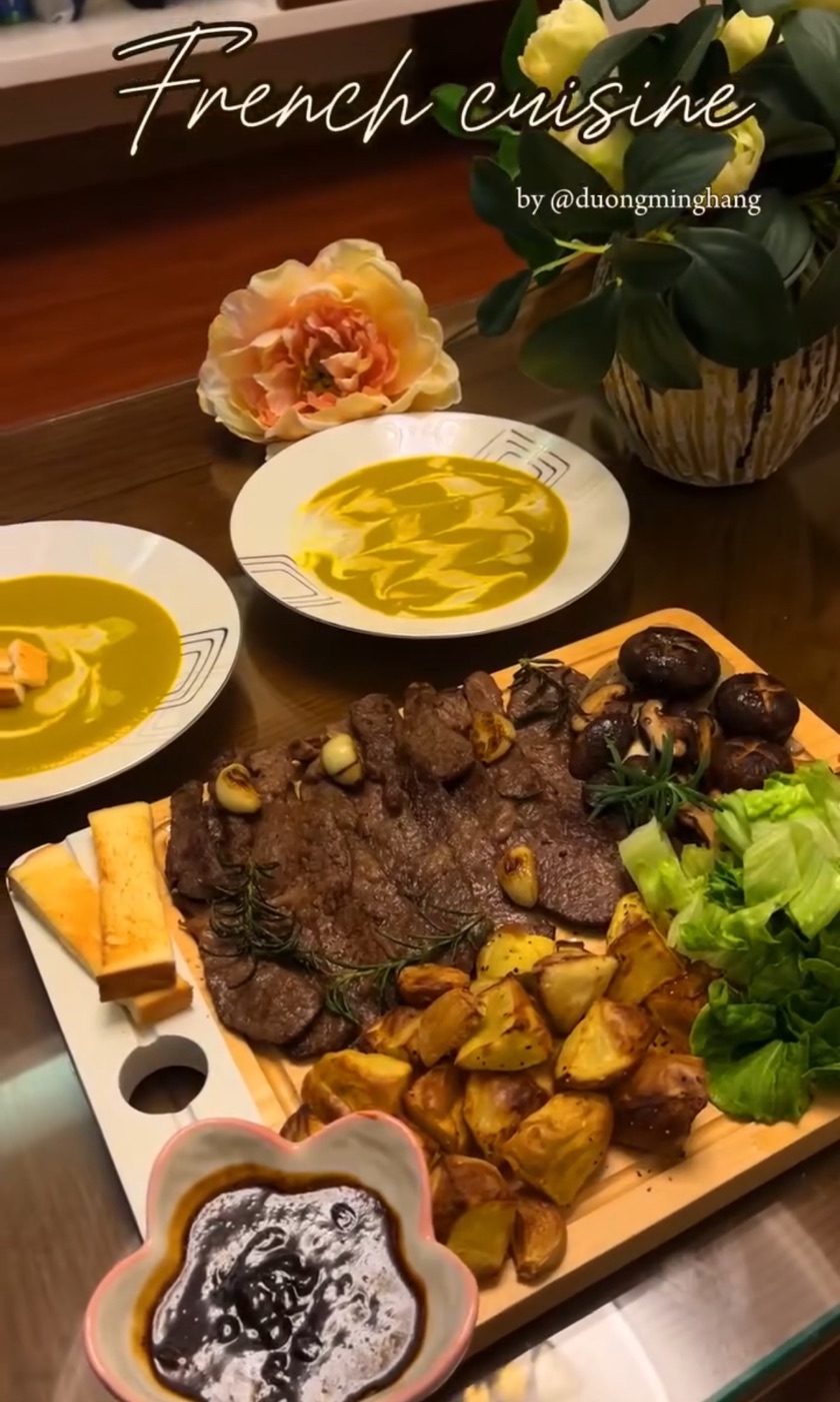 A homemade French-style dinner with steak, mushrooms, potatoes and soup