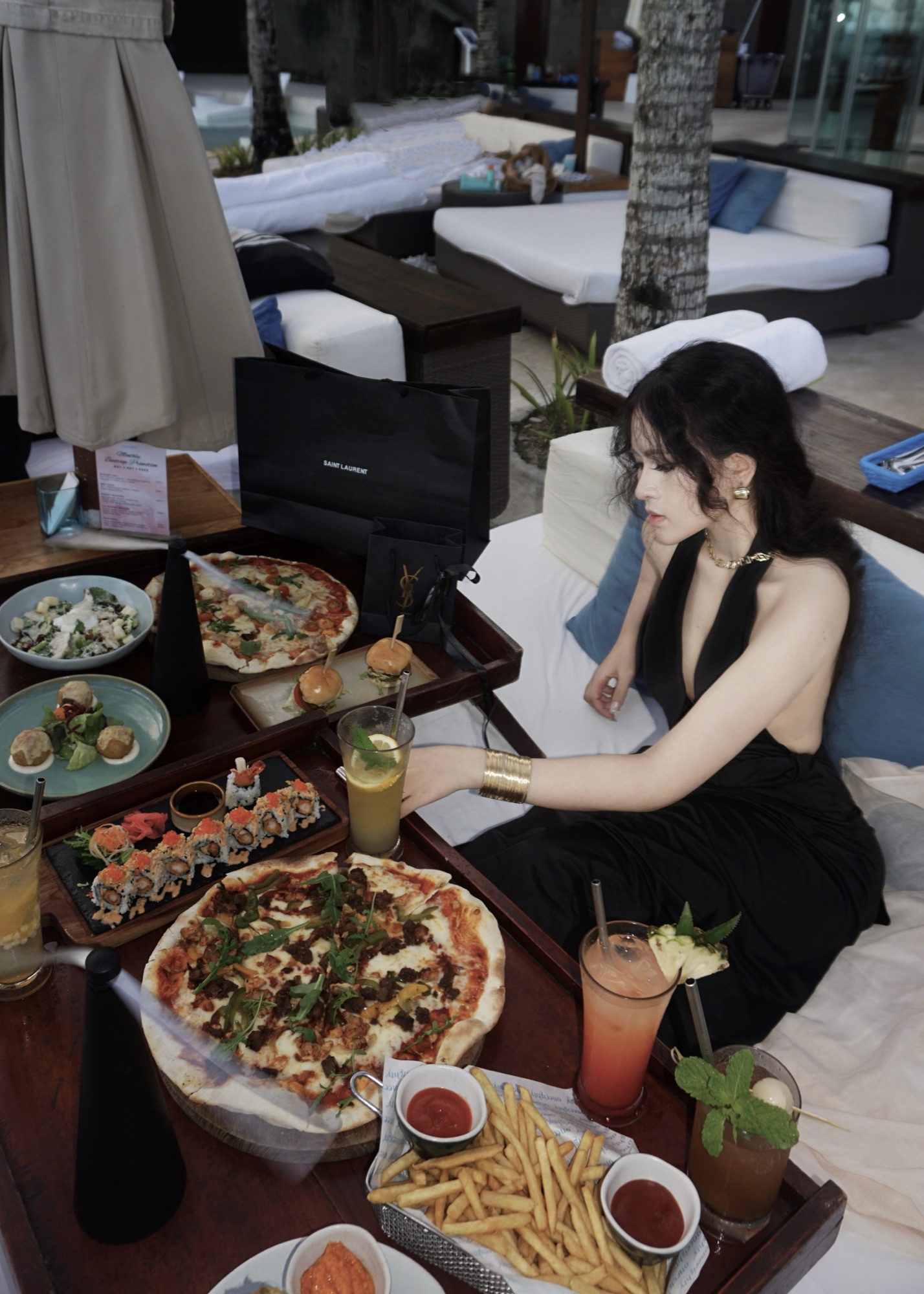 Clara enjoying a meal at a seaside resort