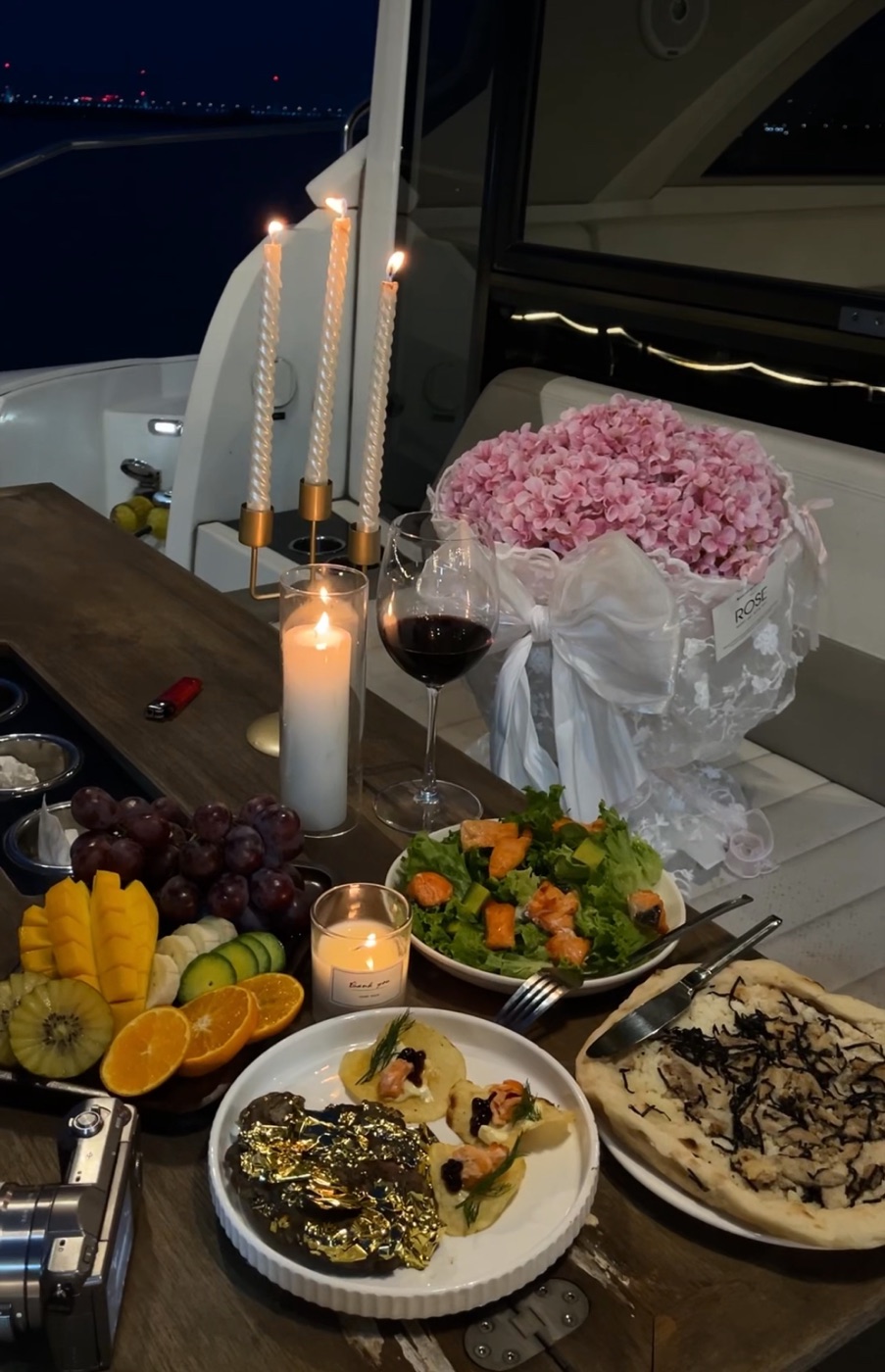 A candlelit feast set aboard a yacht